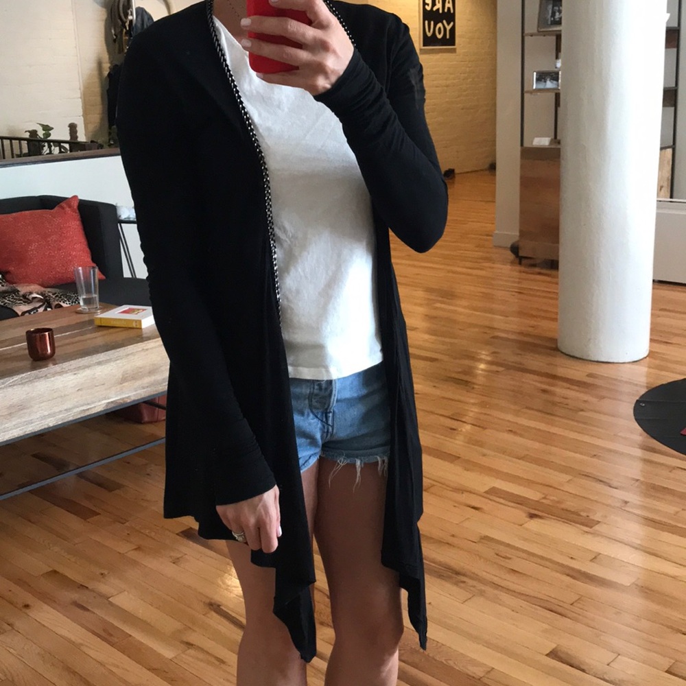 Classic cardigan with edgy twist. Chain trim